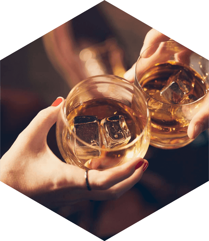 Two rocks glasses with Highwing whiskey and ice.